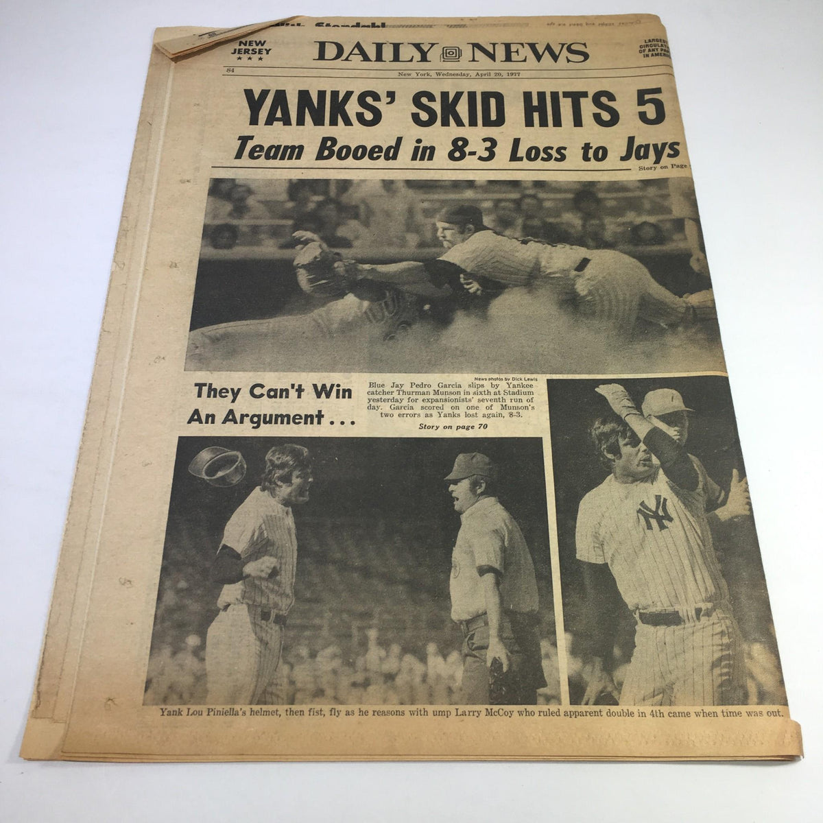 NY Daily News April 20 1977 headline 'YANKS' SKID HITS 5' featuring a baseball game loss headline with photographs of players and manager. The article covers a tough game for the Yankees against the Blue Jays.