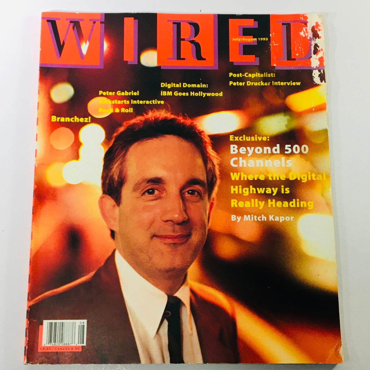 Wired Magazine July August 1993 Vol 1 #3 featuring the cover story 'Beyond 500 Channels' by Mitch Kapor, showcasing a professional portrait with vibrant background lighting.