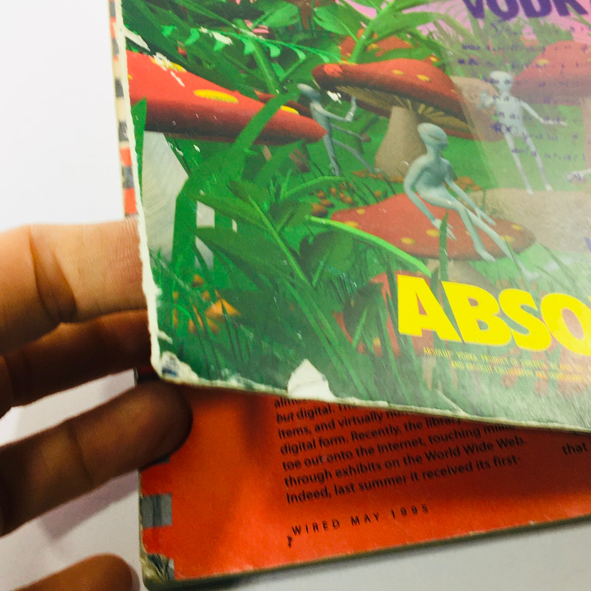 Back cover of Wired Magazine May 1995 Vol 3 #5 with illustrations of alien figures amidst vibrant colors, highlighting the magazine's exploration of futuristic ideas and digital culture.