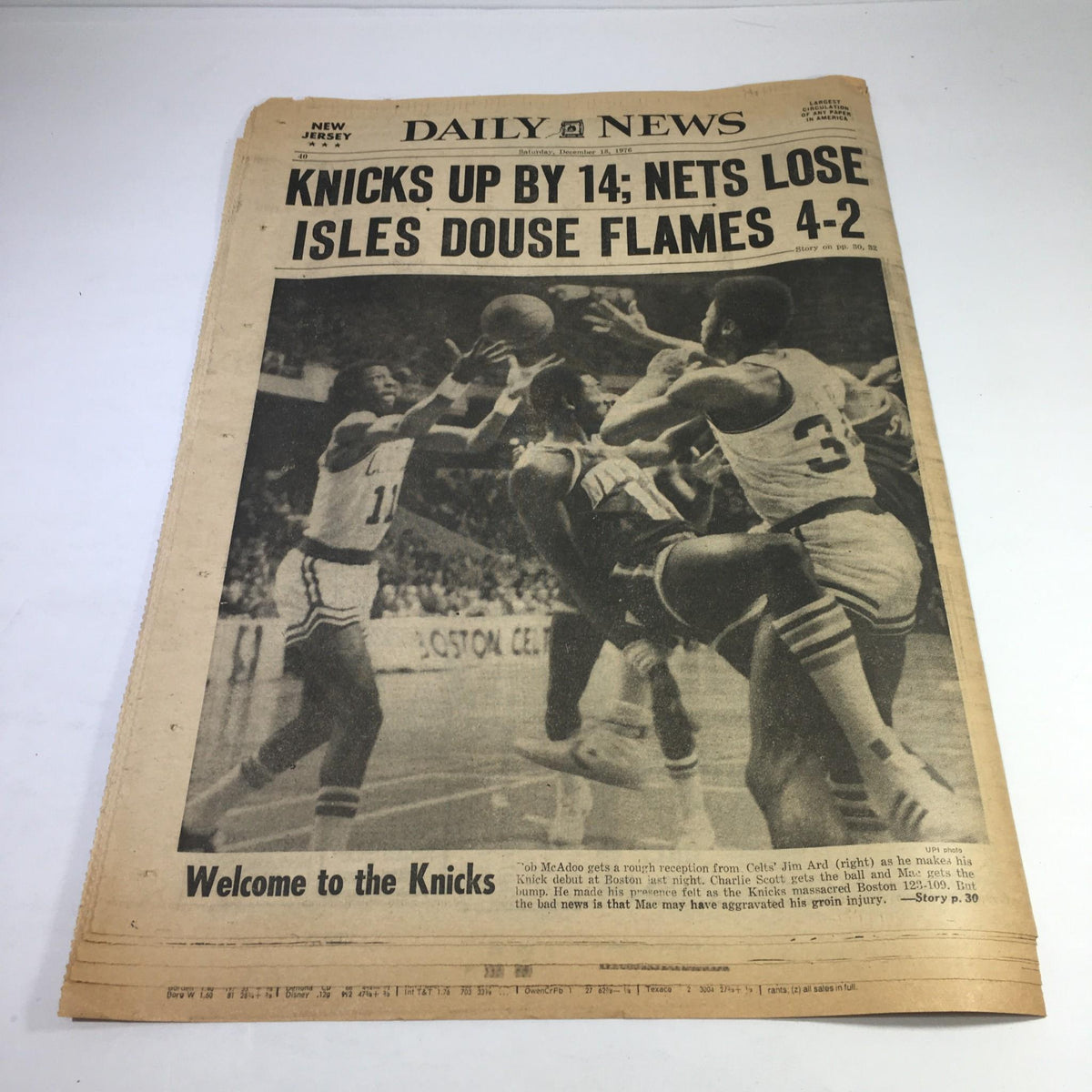 NY Daily News front page from December 18, 1976, reporting on sports with the headline about the Knicks and Nets, highlighting the latest basketball game outcomes.