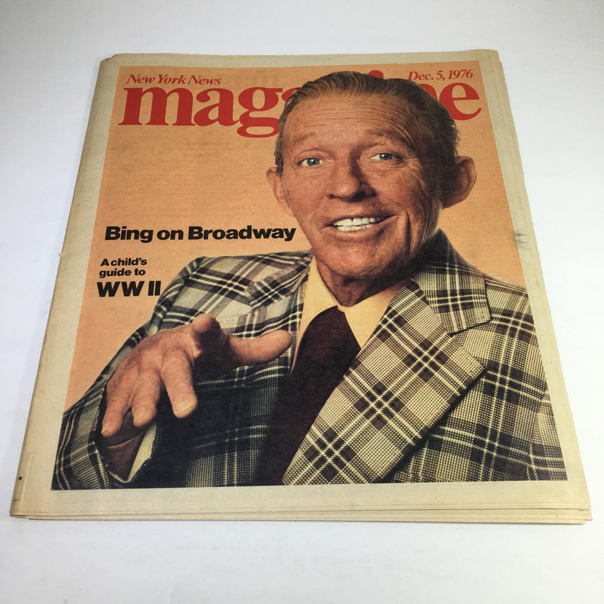 Cover of New York News Magazine dated Dec 5, 1976 featuring the title 'Bing on Broadway A Child's Guide to WW II' with an image of a smiling man in a plaid suit and pointing gesture.