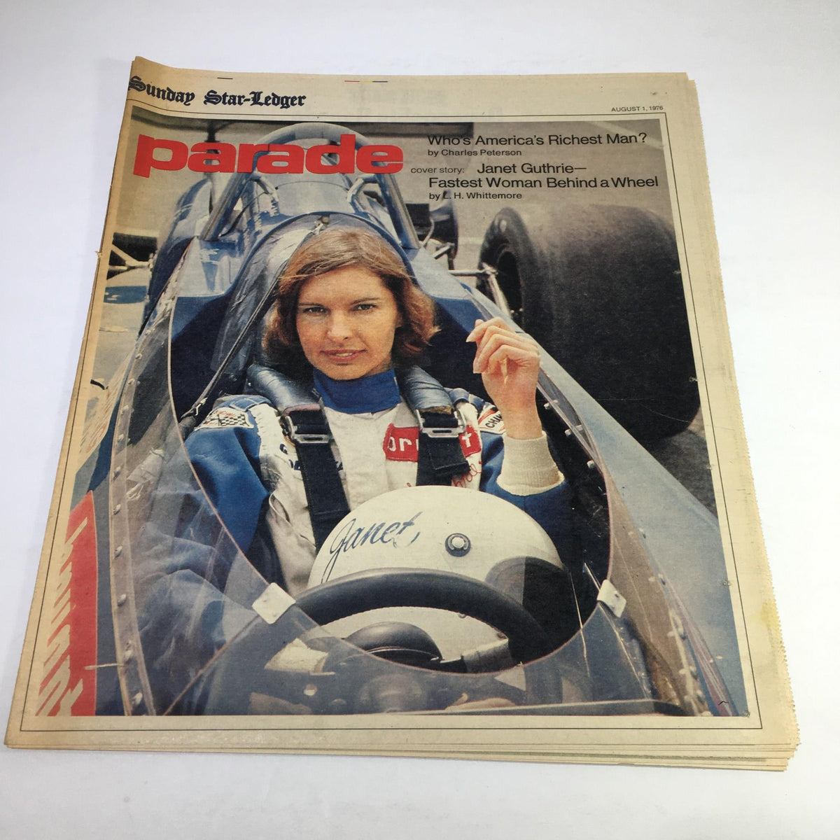 Sunday Star Ledger Aug 1 1976 Parade featuring Janet Guthrie, the fastest woman behind a wheel, seated in a race car with a helmet, symbolizing her achievements in auto racing.