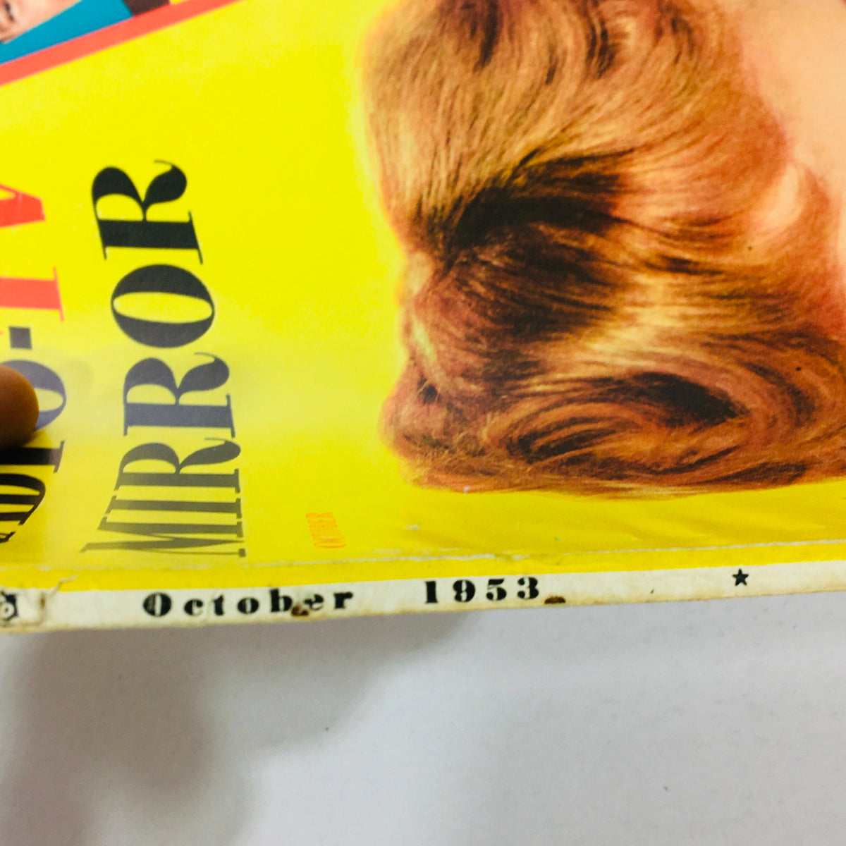 Side view of the VTG Radio-TV Mirror Magazine from October 1953 showing the publication month and year.