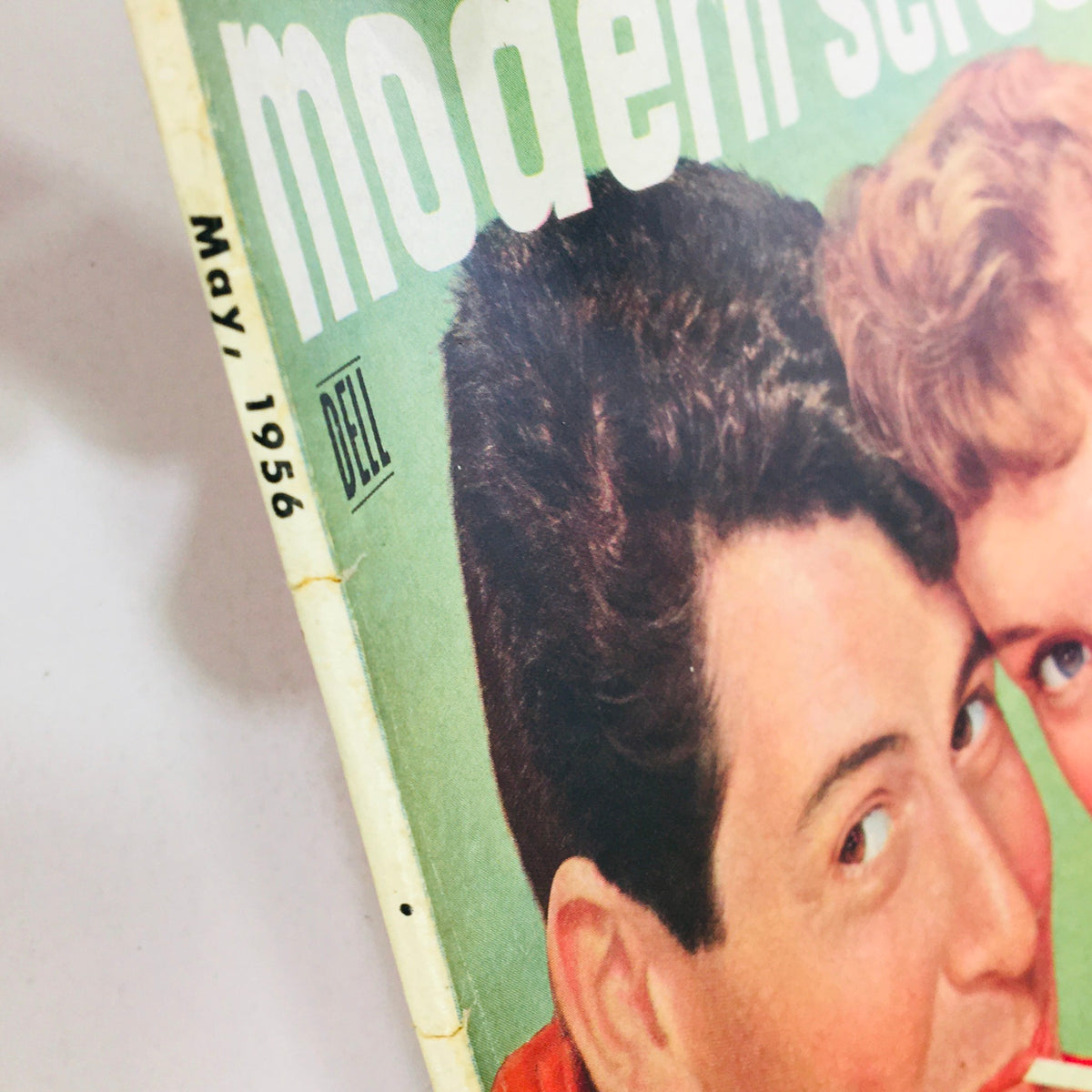 Close-up of the spine of VTG Modern Screen Magazine May 1956 showing the publication date and title.