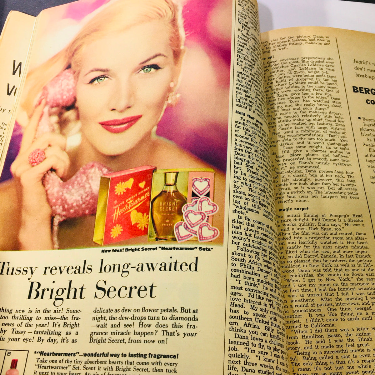 Colorful advertisement featuring actress Dana Wynter promoting Tussy's 'Bright Secret' fragrance, from the May 1956 issue of Modern Screen Magazine.