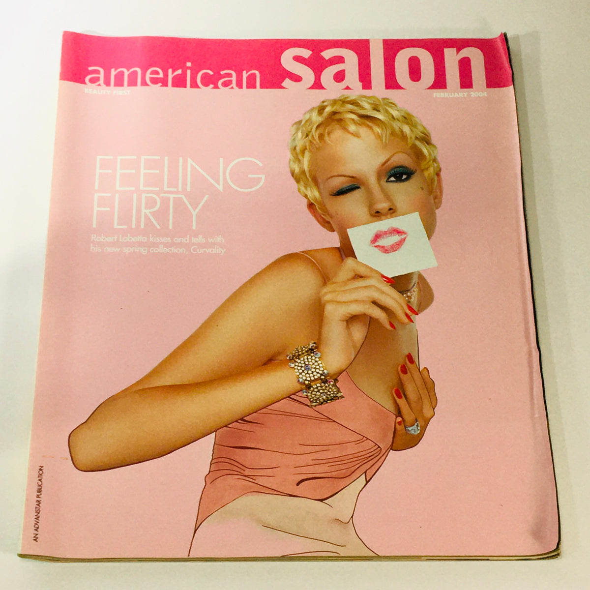 Cover of the American Salon Beauty First February 2004 magazine featuring the theme 'Feeling Flirty' and a stylish model holding a kiss mark note, showcasing early 2000s beauty trends and fashion.