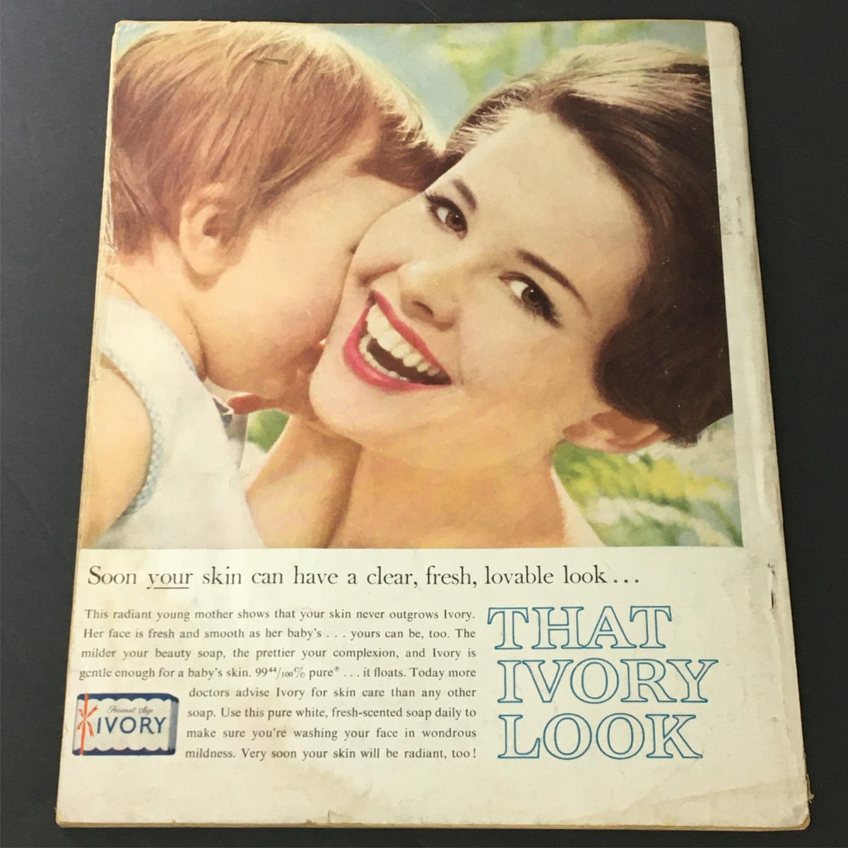 Photoplay Magazine December 1960 emphasizing the theme 'THAT IVORY LOOK' with a cheerful woman and child. Showcases vintage advertising alongside film stars, ideal for fans of retro memorabilia.