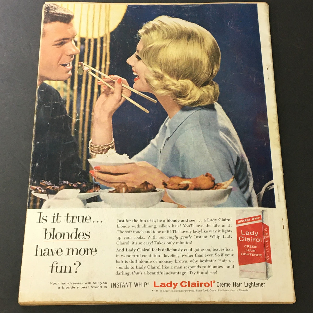 Back cover of VTG Motion Picture Magazine June 1960 featuring a Lady Clairol hair product advertisement with a stylish couple dining.