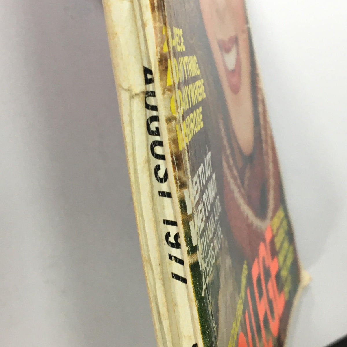 Side view of the Vintage Glamour Magazine August 1977, showing signs of wear and vintage character, perfect for collectors of fashion history.