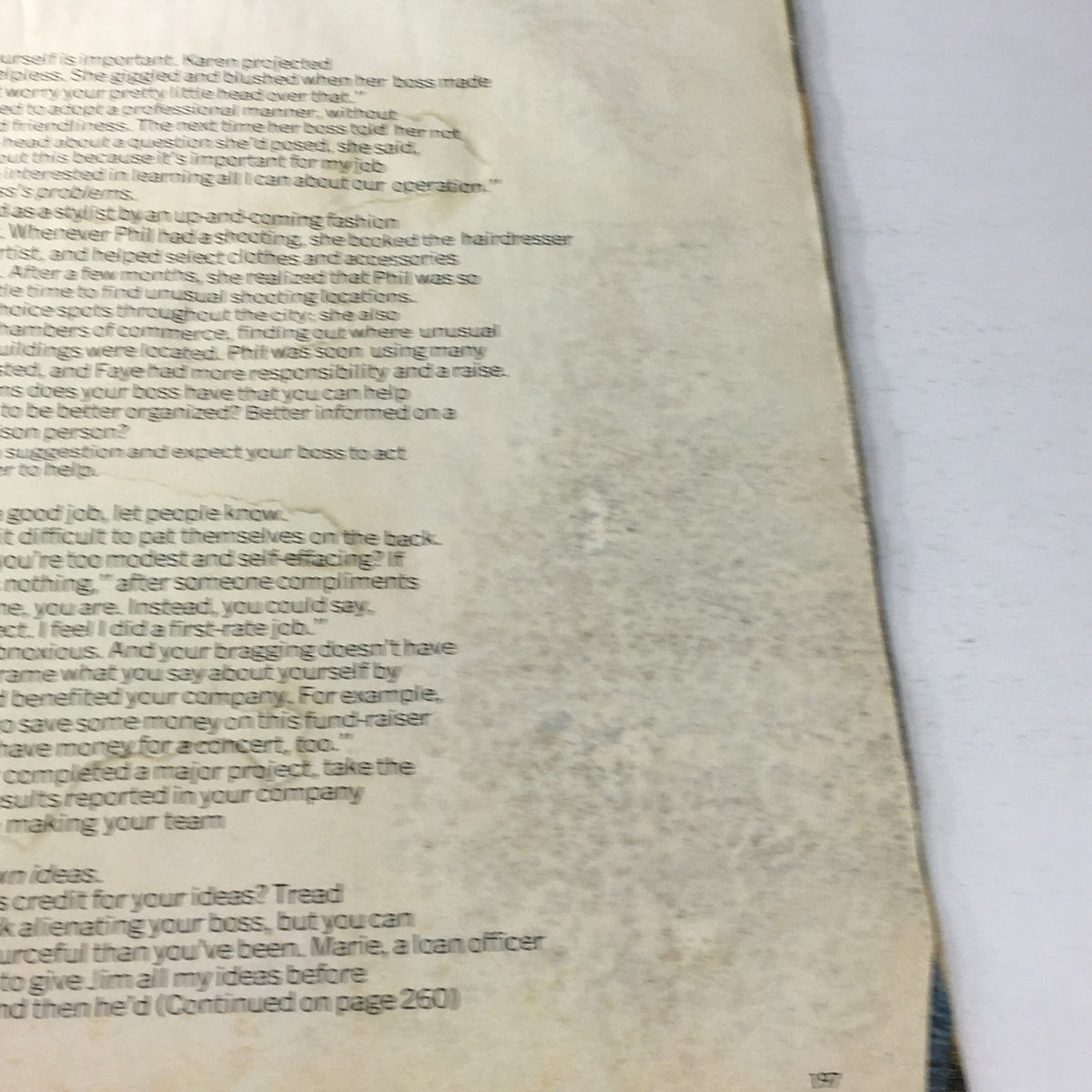 Close-up of text from Vintage Glamour Magazine August 1977, showcasing a sophisticated fashion article with signs of wear, including rips and marks.
