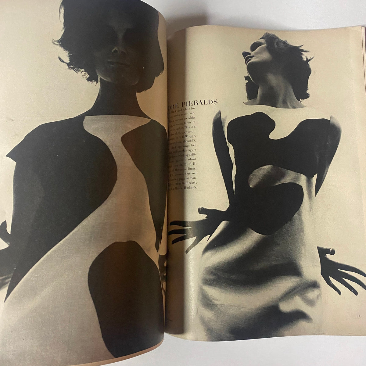 Creative photography in Vogue Magazine December 1962 depicting bold silhouettes in fashion, emphasizing modern design trends of the 1960s.