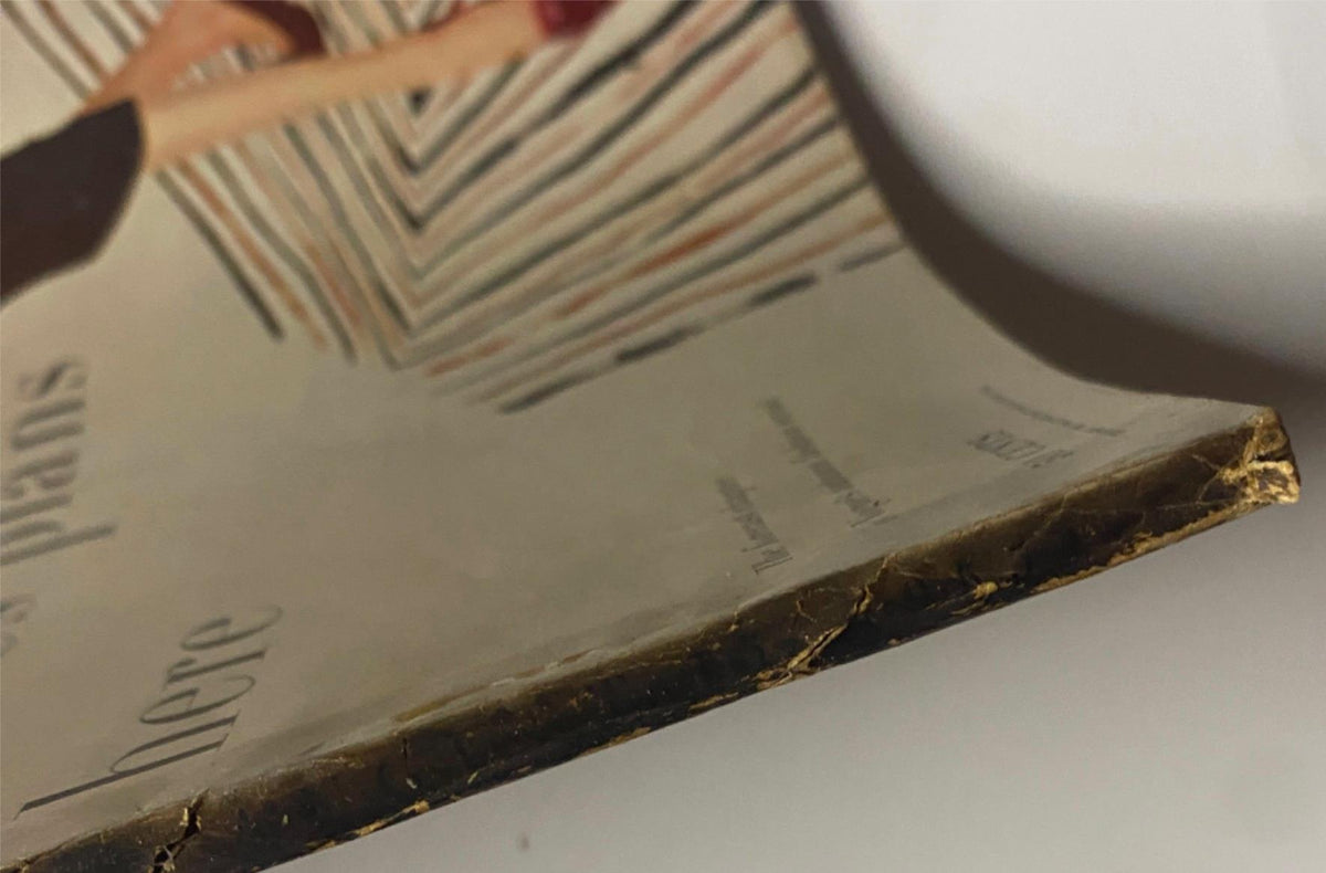 Edge detail of the August 15, 1955 Vogue Magazine, featuring slight wear and aging indicative of its vintage status.