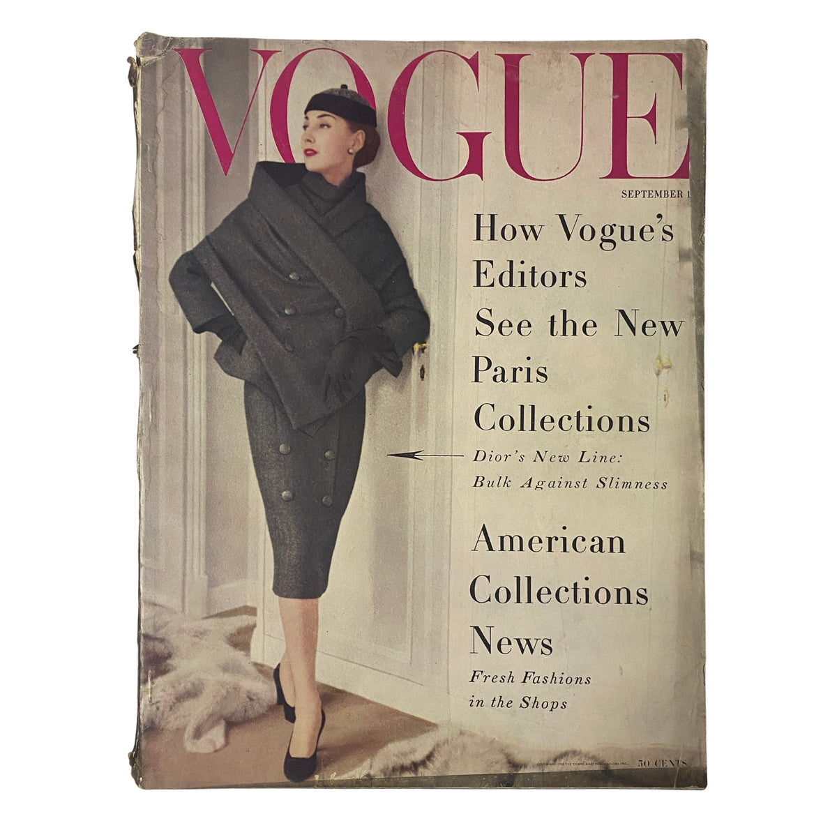 Cover of Vogue Magazine from September 1, 1955 featuring Renée Breton, photographed by Henry Clarke. The issue highlights how Vogue editors view the new Paris collections and presents a stylish model in a gray couture dress, showcasing mid-1950s fashion elegance.