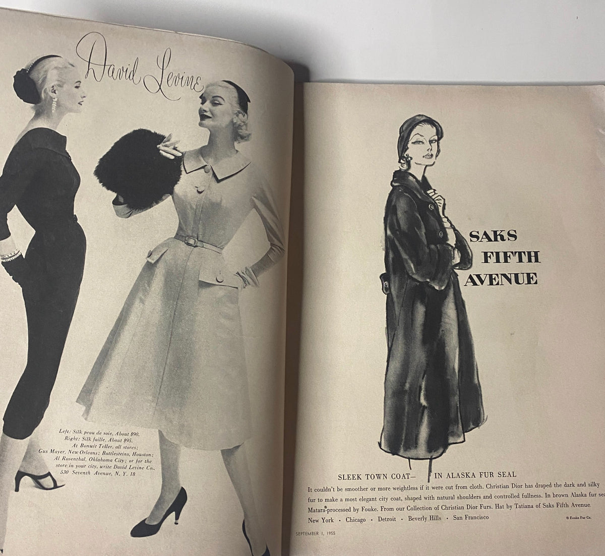 Fashion illustration featuring models in elegant dresses from Vogue Magazine September 1, 1955 Renée Breton Cover by Henry Clarke, highlighting styles available at Saks Fifth Avenue.