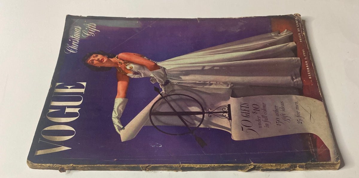 Vogue Magazine December 1, 1941 cover showcasing Betty McLauchlen dressed elegantly, promoting Christmas gifts, captured by photographer John Rawlings.