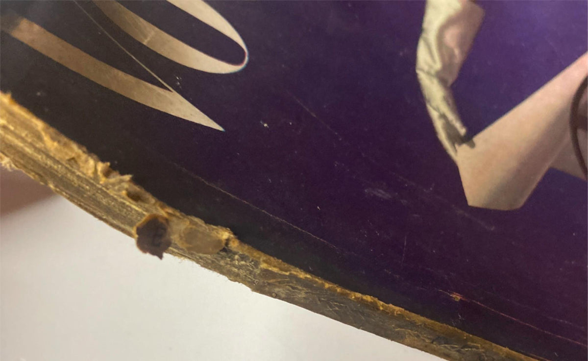 Detail of Vogue Magazine December 1, 1941 cover edge showing wear, emphasizing vintage characteristics of the publication.