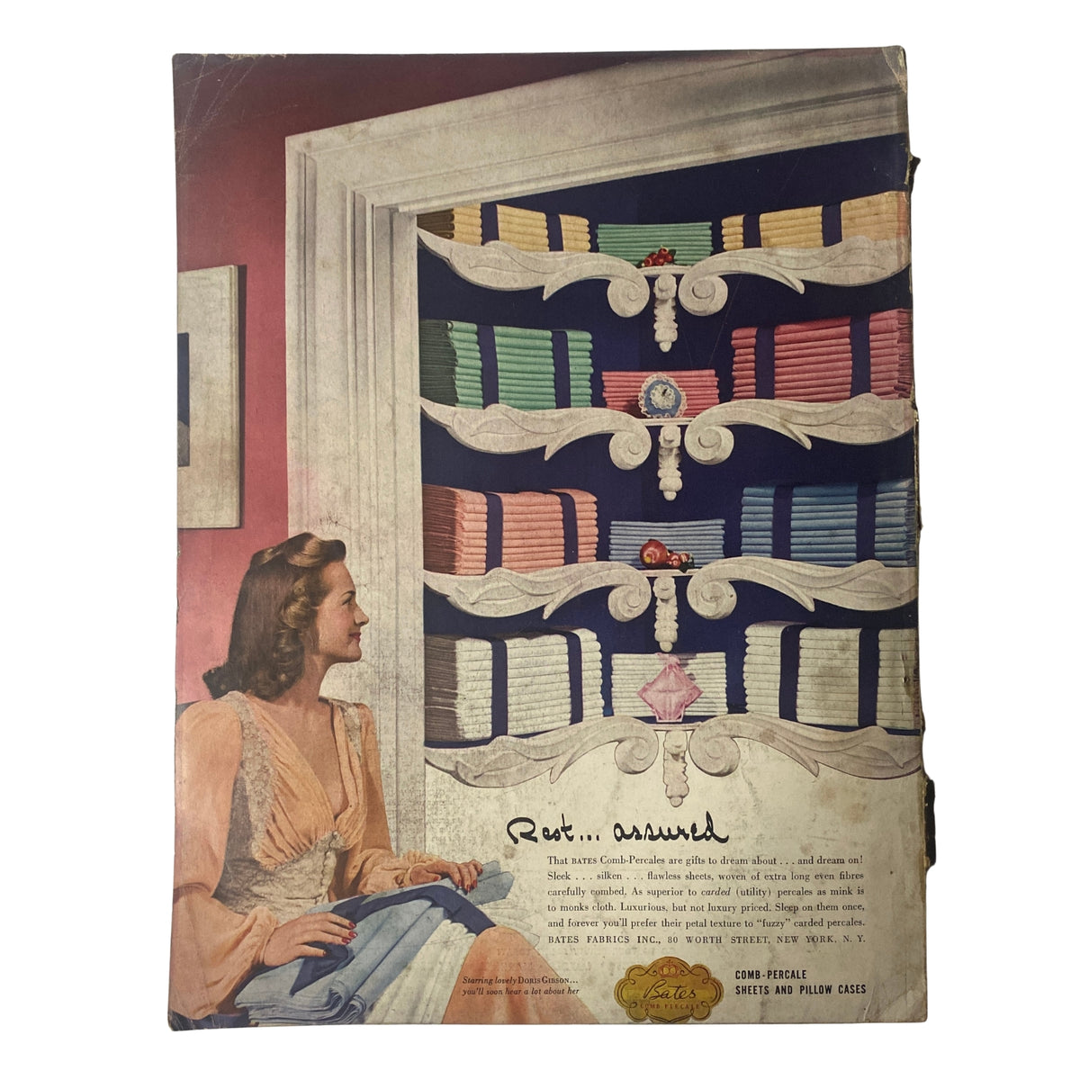Back cover of Vogue Magazine December 1, 1941 Betty McLauchlen Cover by John Rawlings, featuring a woman with colorful fabric swatches, illustrating the magazine's focus on fashion and seasonal trends from the pre-war era.