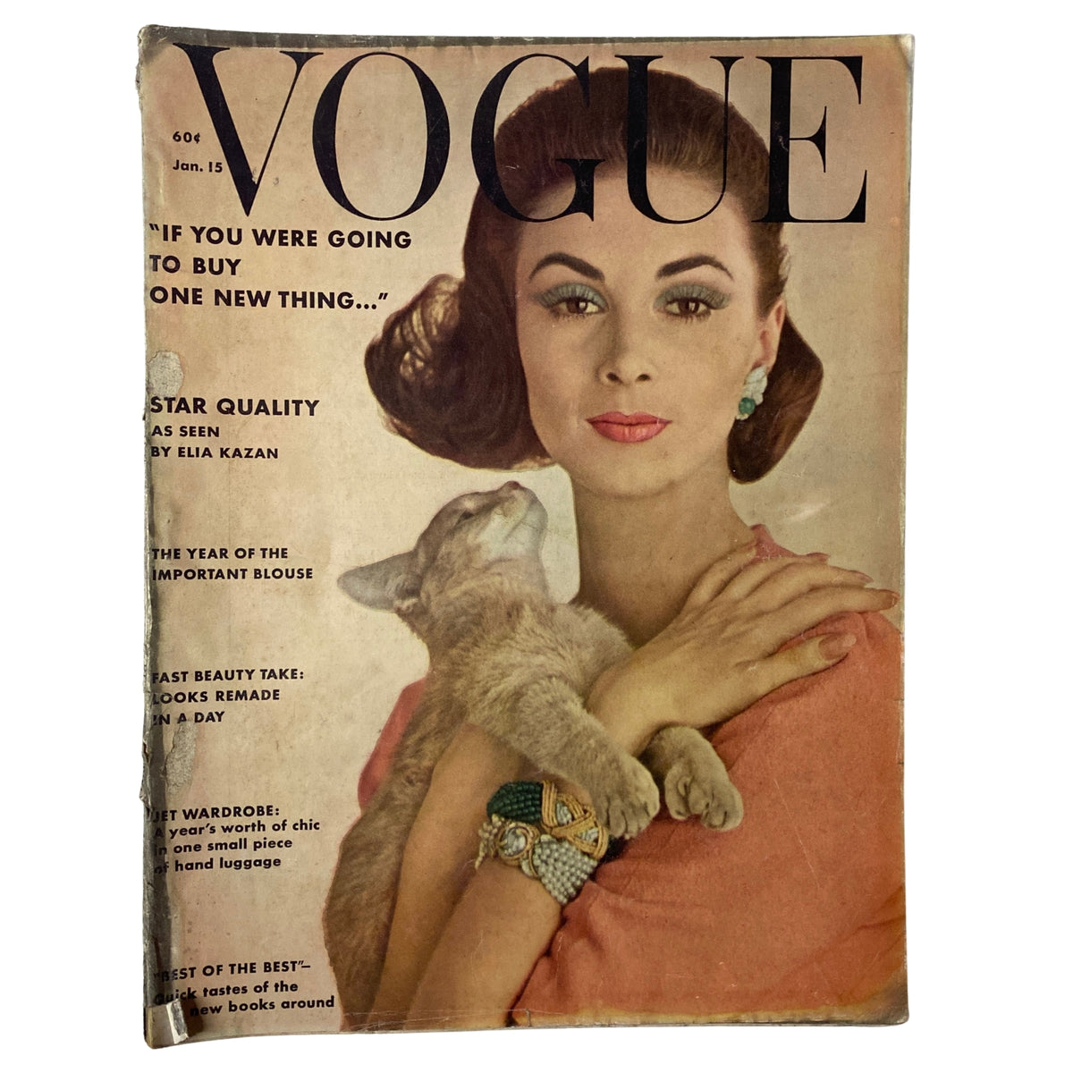 Vogue Magazine January 15, 1962 cover featuring model Wilhelmina Cooper by Karen Radkai, showcasing her portrait and a cat, emphasizing mid-century fashion and style.