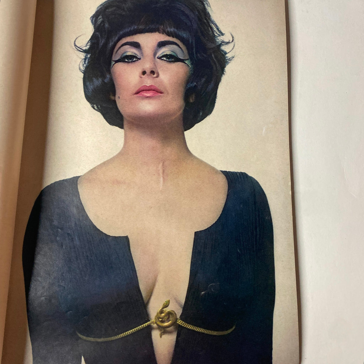 Vogue Magazine January 15, 1962 showcasing an iconic image of Elizabeth Taylor with dramatic makeup and hairstyle, photographed by Karen Radkai.