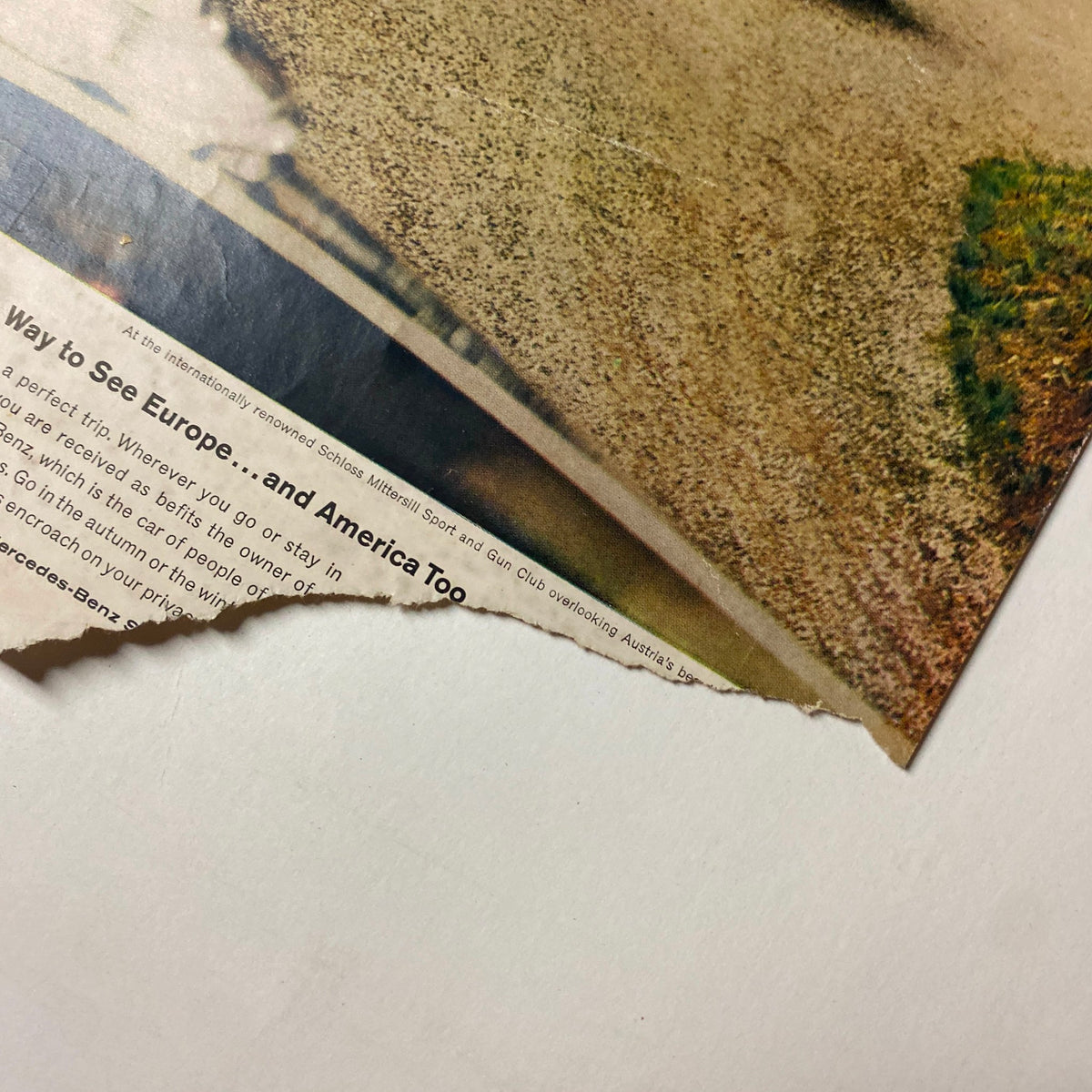 Vogue Magazine January 15, 1962 showing a torn advertisement page, hinting at the vintage condition and age of the magazine.