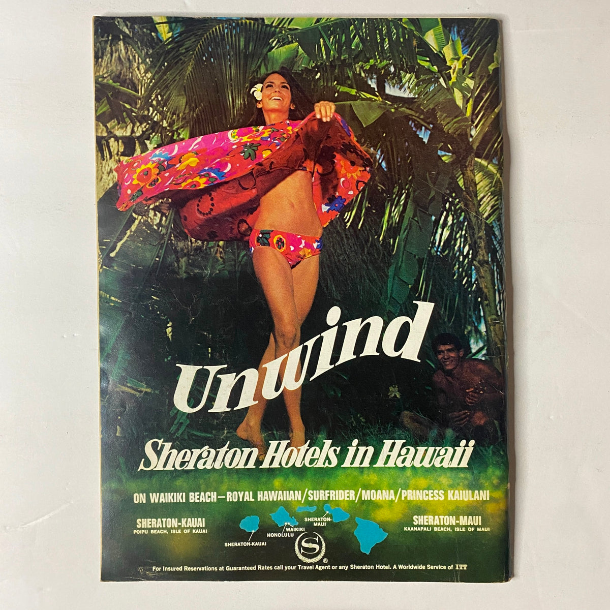 Vintage advertisement for Sheraton Hotels in Hawaii featured on the back of The New Yorker Full Magazine May 3, 1969 showcasing a woman in colorful swimwear.