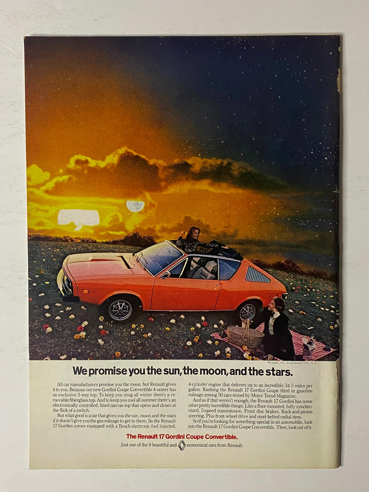 Advertisement in The New Yorker Full Magazine July 15, 1974 for the Renault 17 Gordini Coupe Convertible, showcasing a colorful car against a dreamy starry background.