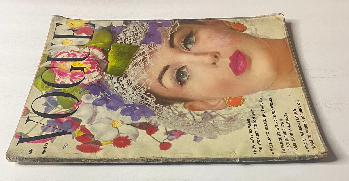 Styled cover of Vogue Magazine April 15, 1962 highlighted by model Dorothy McGowan, showcasing bold makeup and floral accents.