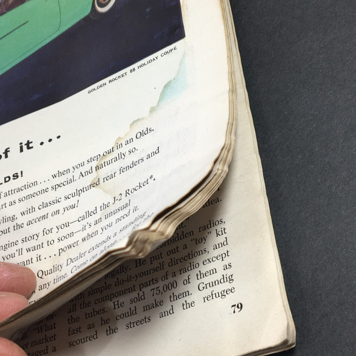 Close-up of a vintage Newsweek magazine from June 3, 1957 featuring Sherman Adams, showcasing an advertisement page with visible wear and tear.