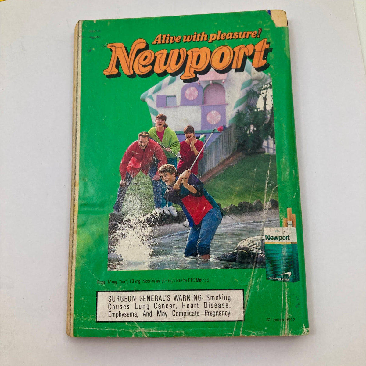 Back cover of TV Guide Magazine July 4 1992, featuring a colorful advertisement for Newport cigarettes with a group of people enjoying outdoor fun and festivities.