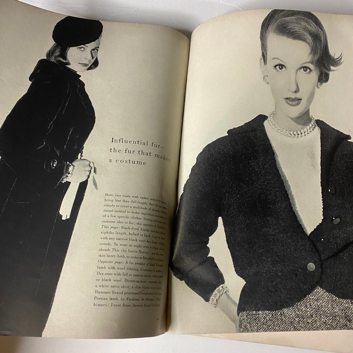 Vogue Magazine October 1, 1954 page displaying a model in a sophisticated outfit with a focus on influential fur fashion styles.