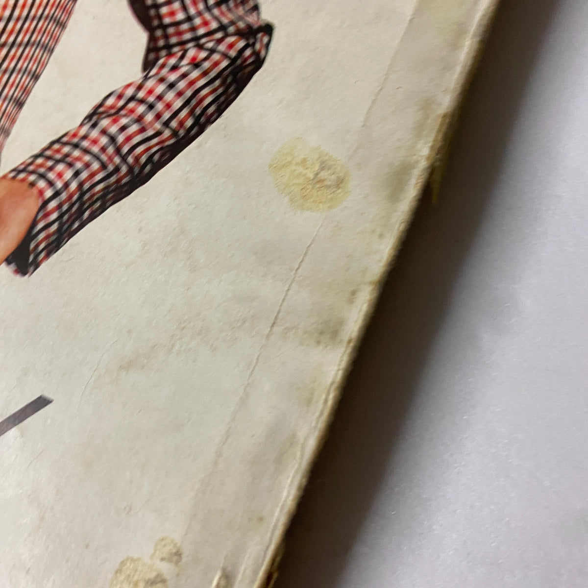 Cover detail from Vogue Magazine April 15, 1939, showing signs of wear with a prominent hand pattern on the cover, reflecting its vintage nature.