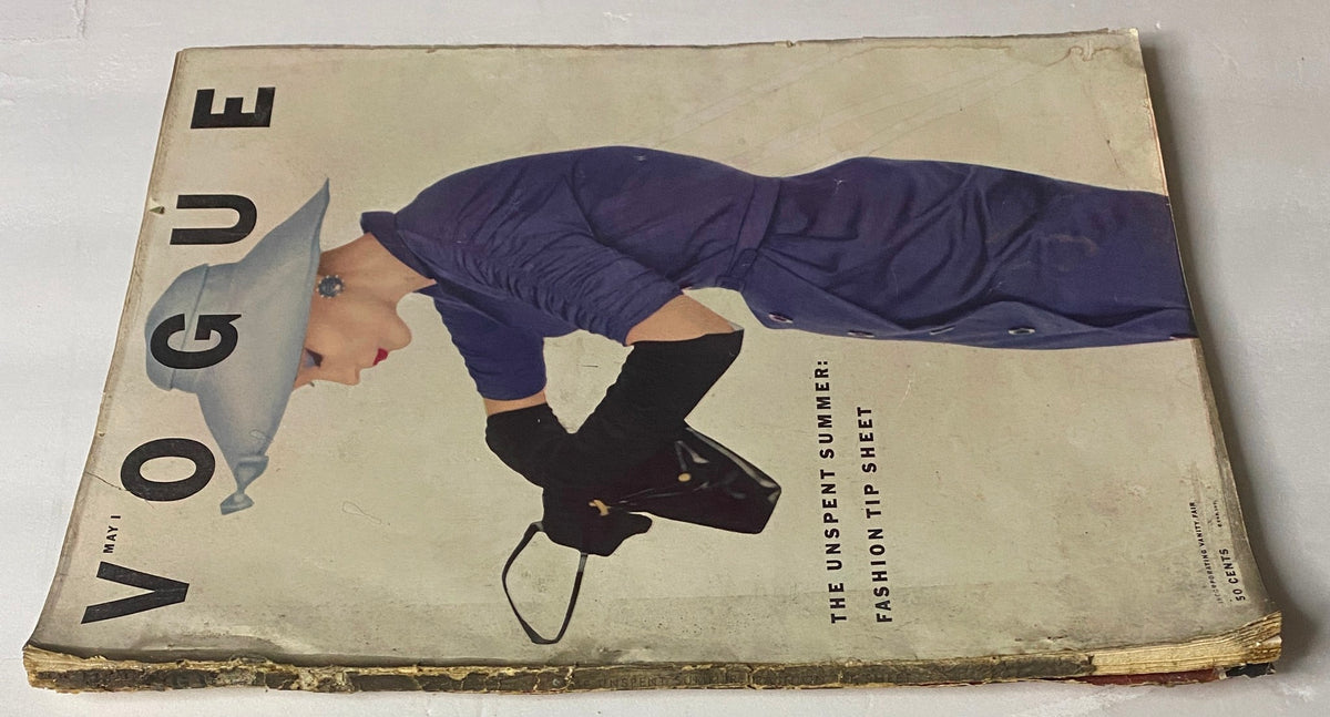 Vogue Magazine May 1, 1952 showcasing the cover design featuring Lisa Fonssagrives in a stylish purple outfit, emphasizing vintage fashion details.