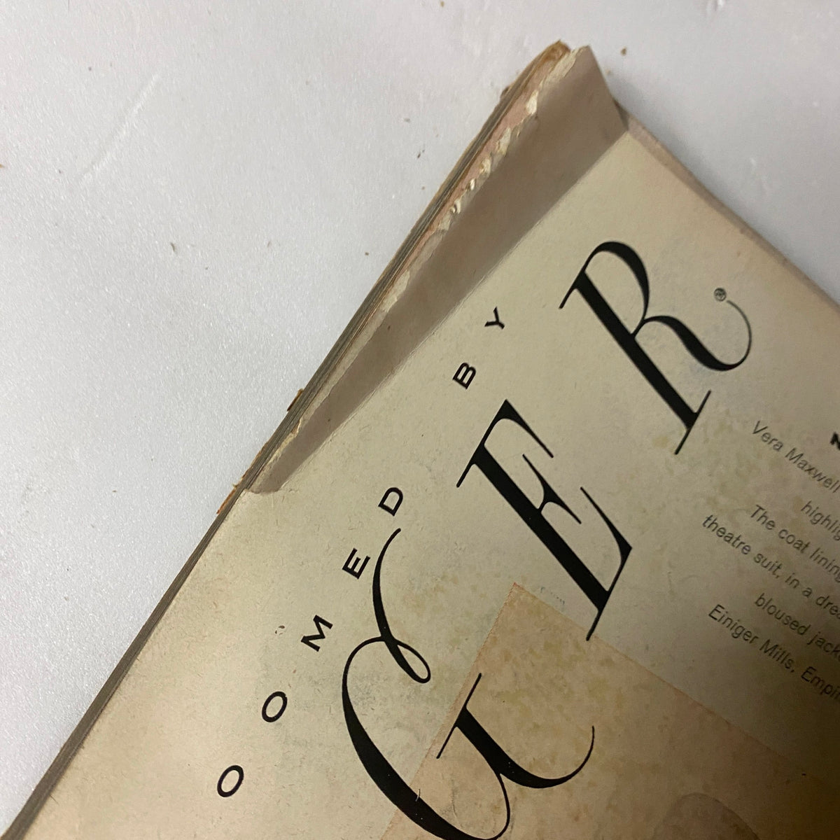Damage detail of the cover edge from Vogue Magazine September 1, 1957, indicating vintage wear and history, reflective of its storage over the decades.