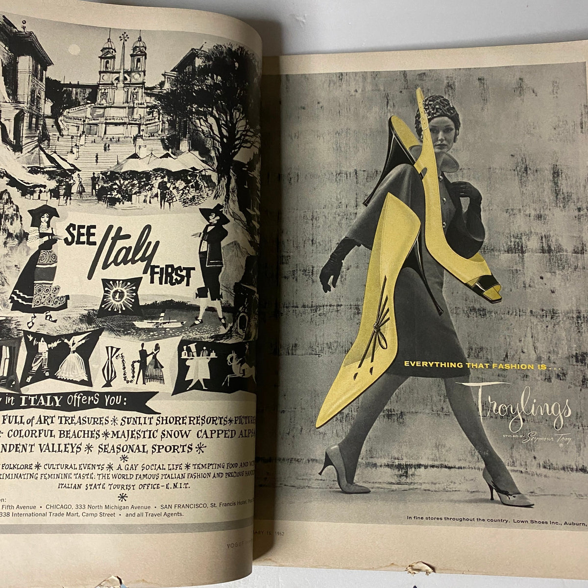 Advertisement page from Vogue Magazine February 15, 1962, featuring a stylish black and white image of a model showcasing a yellow high-heeled shoe, encapsulating the essence of modern fashion.