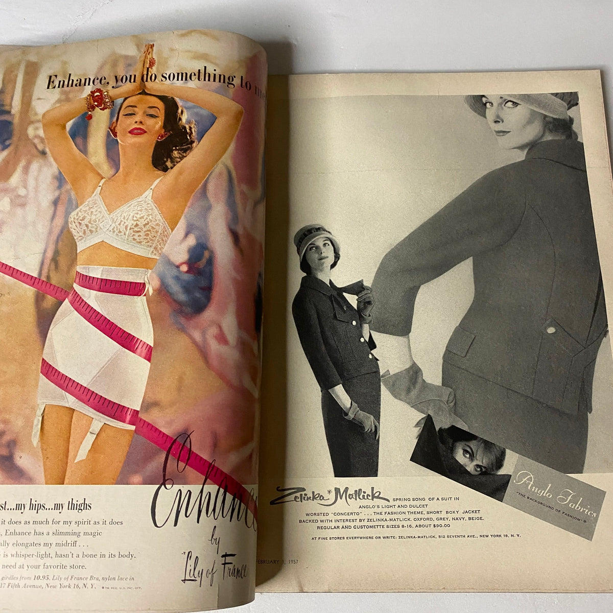 Vogue Magazine February 1, 1957 highlighting a fashion advertisement for Lily of France undergarments, featuring elegant models in stylish outfits.