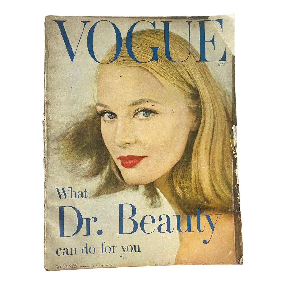 Vogue Magazine May 1957 featuring Ann Klem on the cover, showcasing a beauty theme with the headline 'What Dr. Beauty can do for you'.