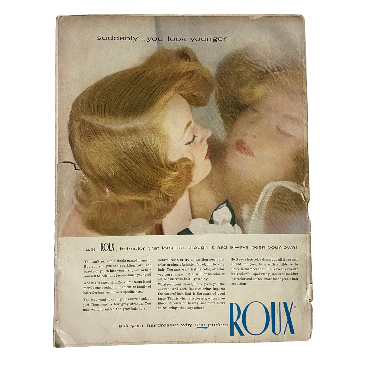 Back cover of Vogue Magazine May 1957 featuring Roux haircare advertisement, portraying a woman looking into a mirror, emphasizing beauty and youth. Ann Klem Cover by Irving Penn.