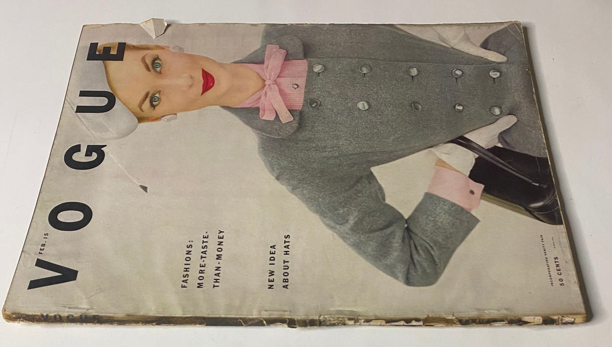 Cover of Vogue Magazine dated February 15, 1952 featuring Janet Randy, captured by Clifford Coffin. The image showcases a model dressed in a stylish gray outfit with a pink bow, epitomizing early 1950s fashion.