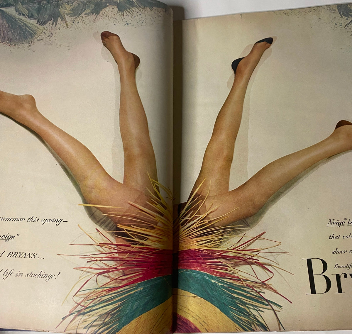 Vogue Magazine February 15, 1952 featuring Janet Randy, with an artistic display of legs in colorful stockings, highlighting fashion trends for spring.