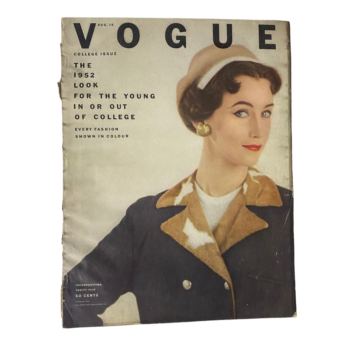 Vogue Magazine August 15, 1952 cover featuring model Ruth Neumann, styled in a collegiate look for the College Issue, showcasing the fashion trends for young adults. Photographed by Richard Rutledge.