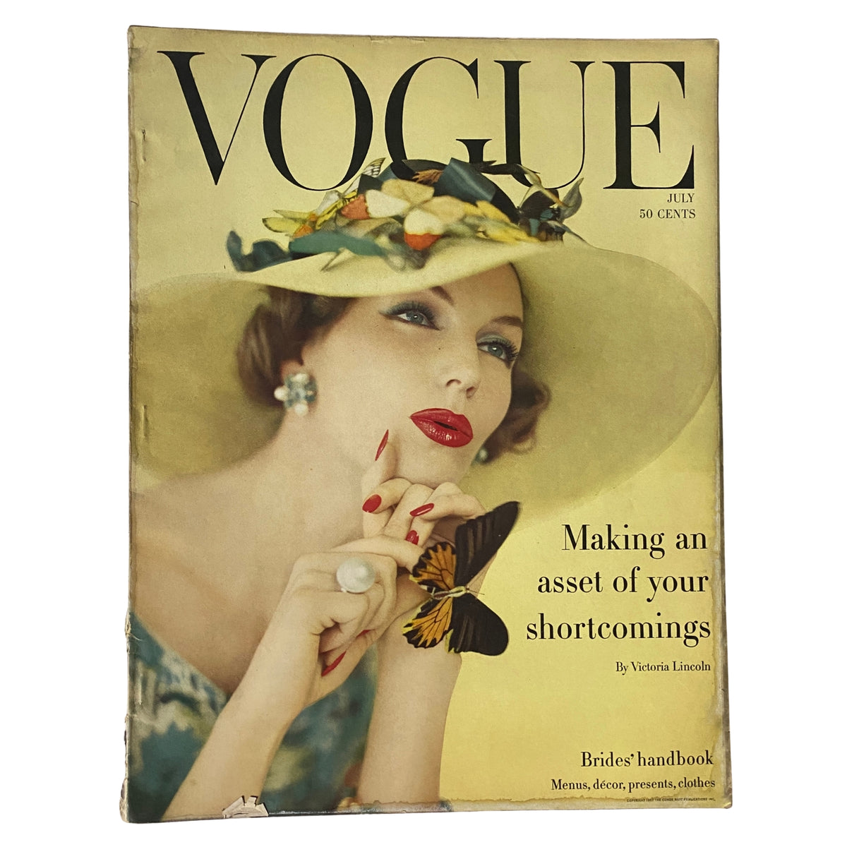 Vogue Magazine July 1957 cover featuring model Joanna McCormick, photographed by Karen Radkai. The cover highlights the theme 'Making an asset of your shortcomings' with a striking pose and a butterfly motif.