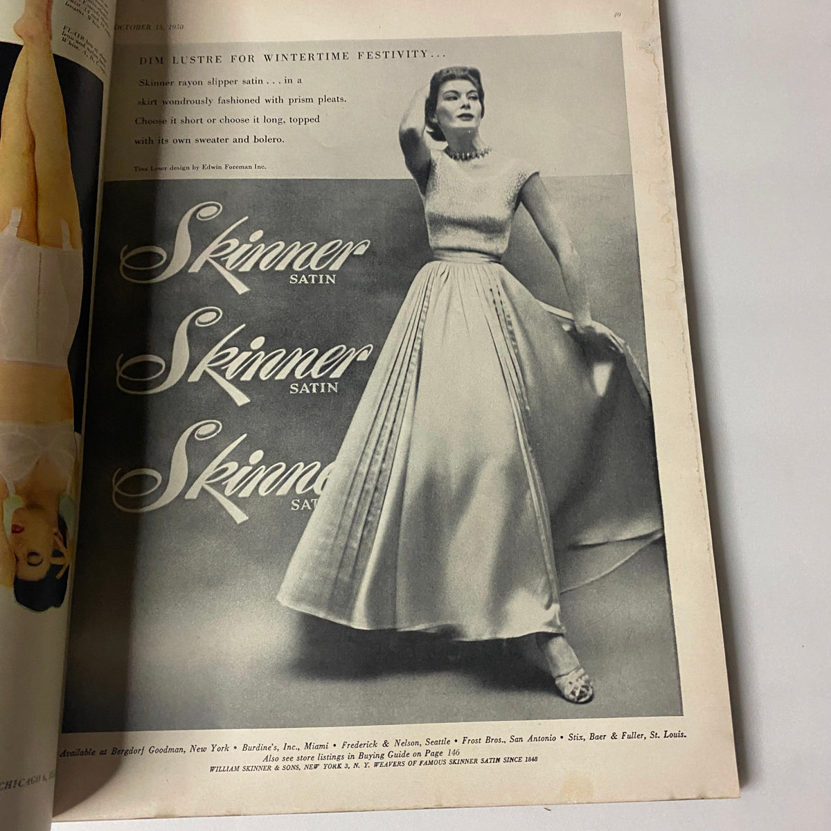Fashion advertisement page from Vogue Magazine October 15, 1950 Jean Patchett Cover by Horst P. Horst, featuring a model in a Skinner satin dress.