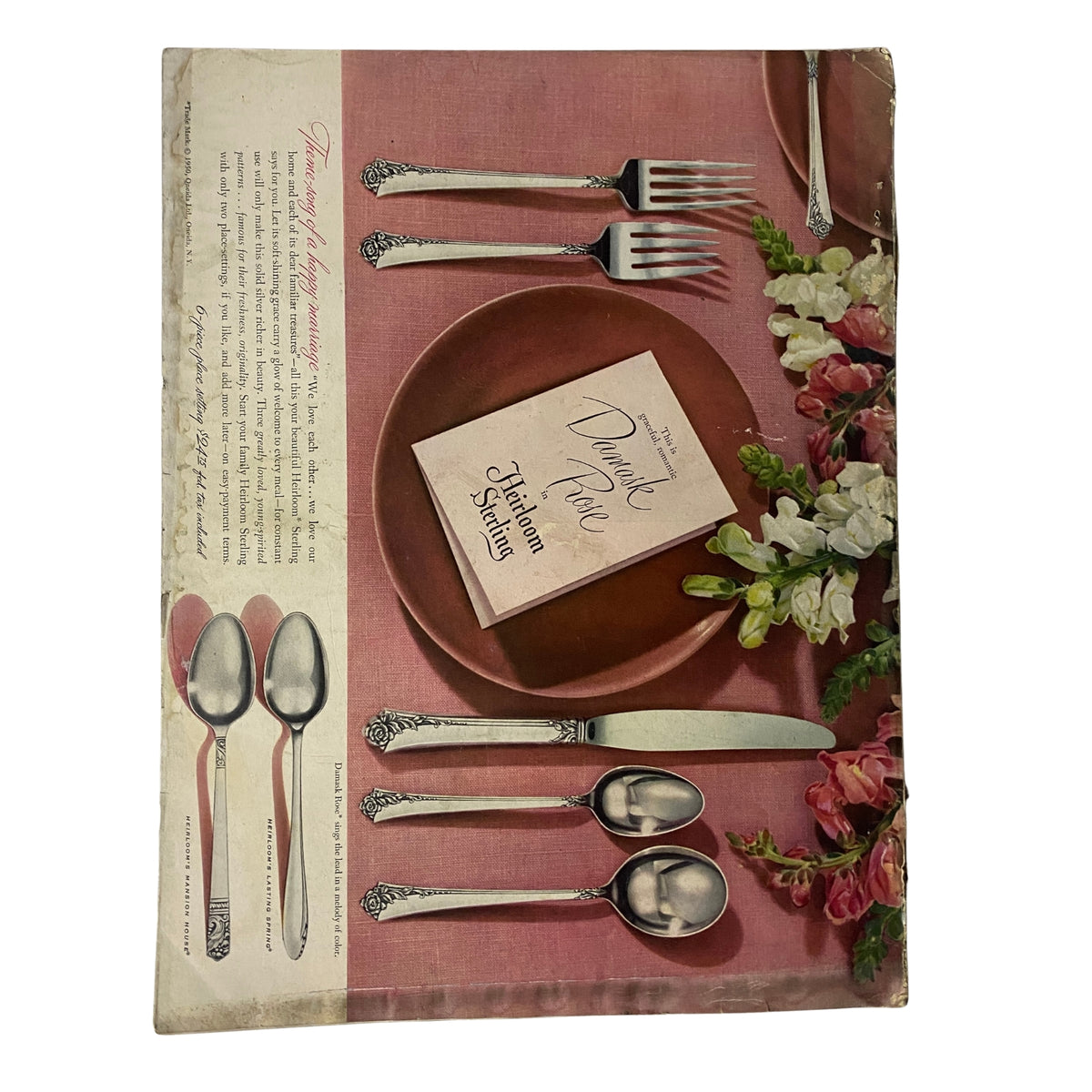 Back cover of Vogue Magazine October 15, 1950, featuring an elegant table setting with flatware and a plate, showcasing vintage design aesthetics. This issue includes fashion insights and cultural commentary.