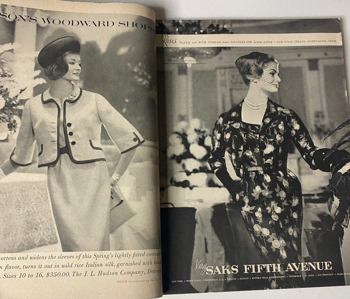A vintage fashion spread from Vogue Magazine March 1, 1960 featuring models in stylish outfits, showcasing contemporary trends from the era, with elegant designs and floral decorations in the background.
