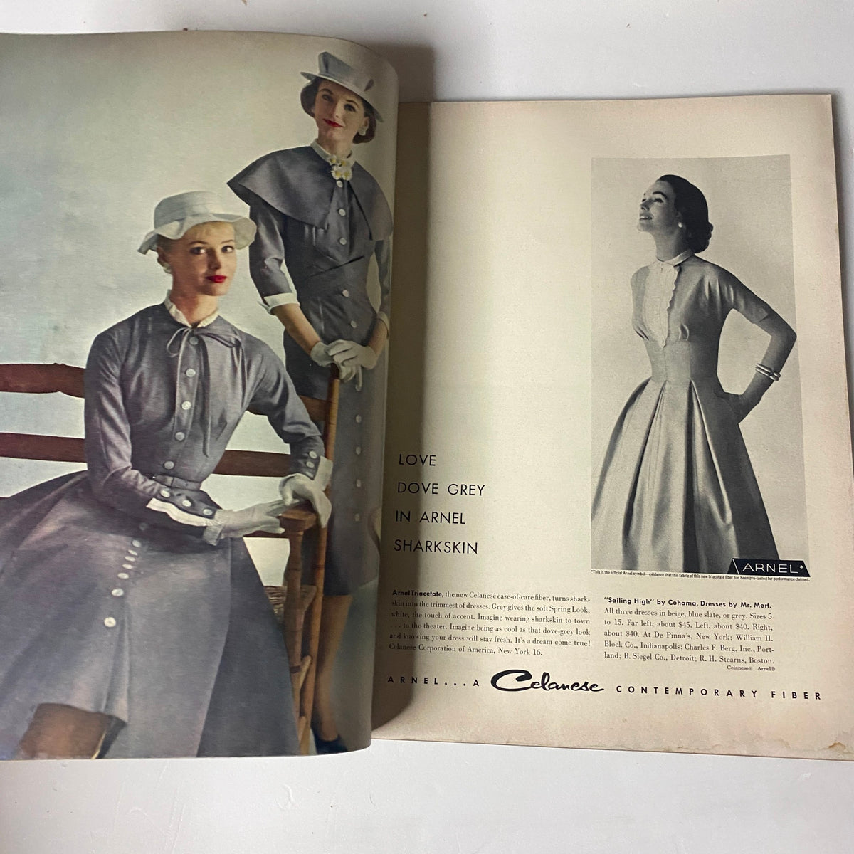 Vintage advertisement page from Vogue Magazine March 15, 1957 showcasing grey dresses in Arnel sharkskin, illustrating the fabric innovations and styles of mid-century design.