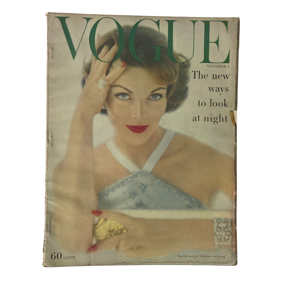 Vogue Magazine November 1, 1957 featuring Va Taylor on the cover, showcasing glamour and elegance with vibrant colors.