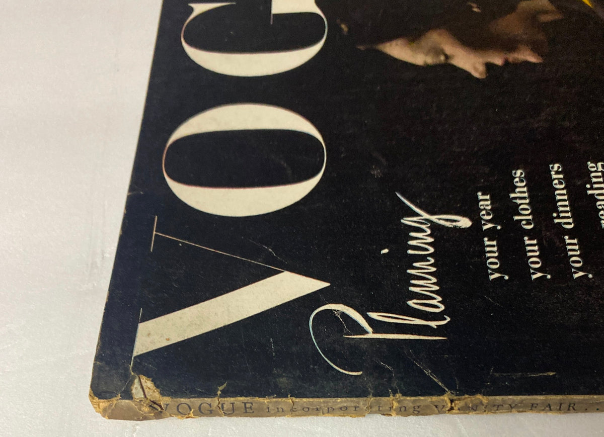Detail of the Vogue Magazine January 1, 1944 cover, highlighting edges and wear, capturing the vintage aesthetic and importance of preservation in collectible magazines.