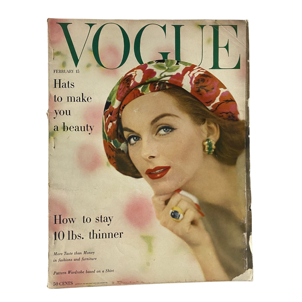 Cover of Vogue Magazine February 15, 1957 featuring Anne St. Marie with a stylish hat, showcasing mid-century fashion and beauty tips, photographed by Karen Radkai.