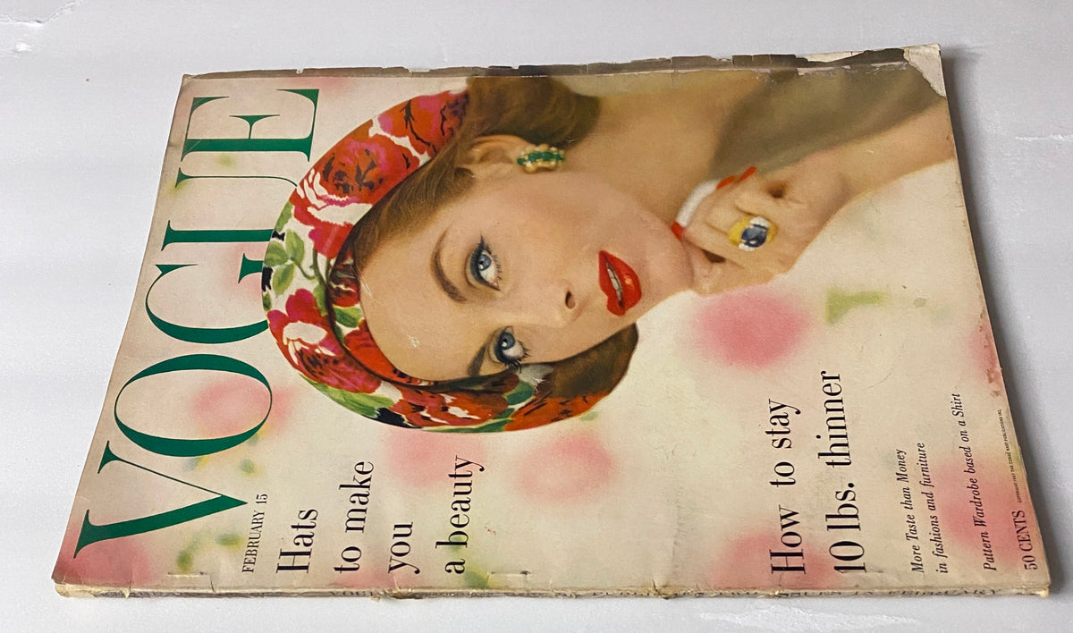 Cover of Vogue Magazine February 15, 1957 featuring Anne St. Marie photographed by Karen Radkai, showcasing vibrant fashion with a floral motif and striking accessories.
