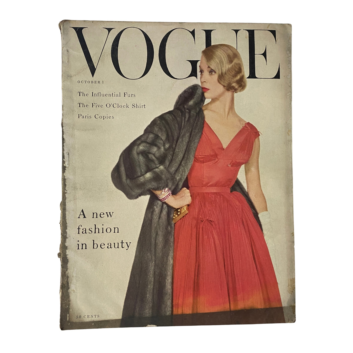 Cover of Vogue Magazine October 1, 1954 featuring model Jean Patchett in a red dress, photographed by Horst P. Horst, showcasing mid-century fashion elegance.